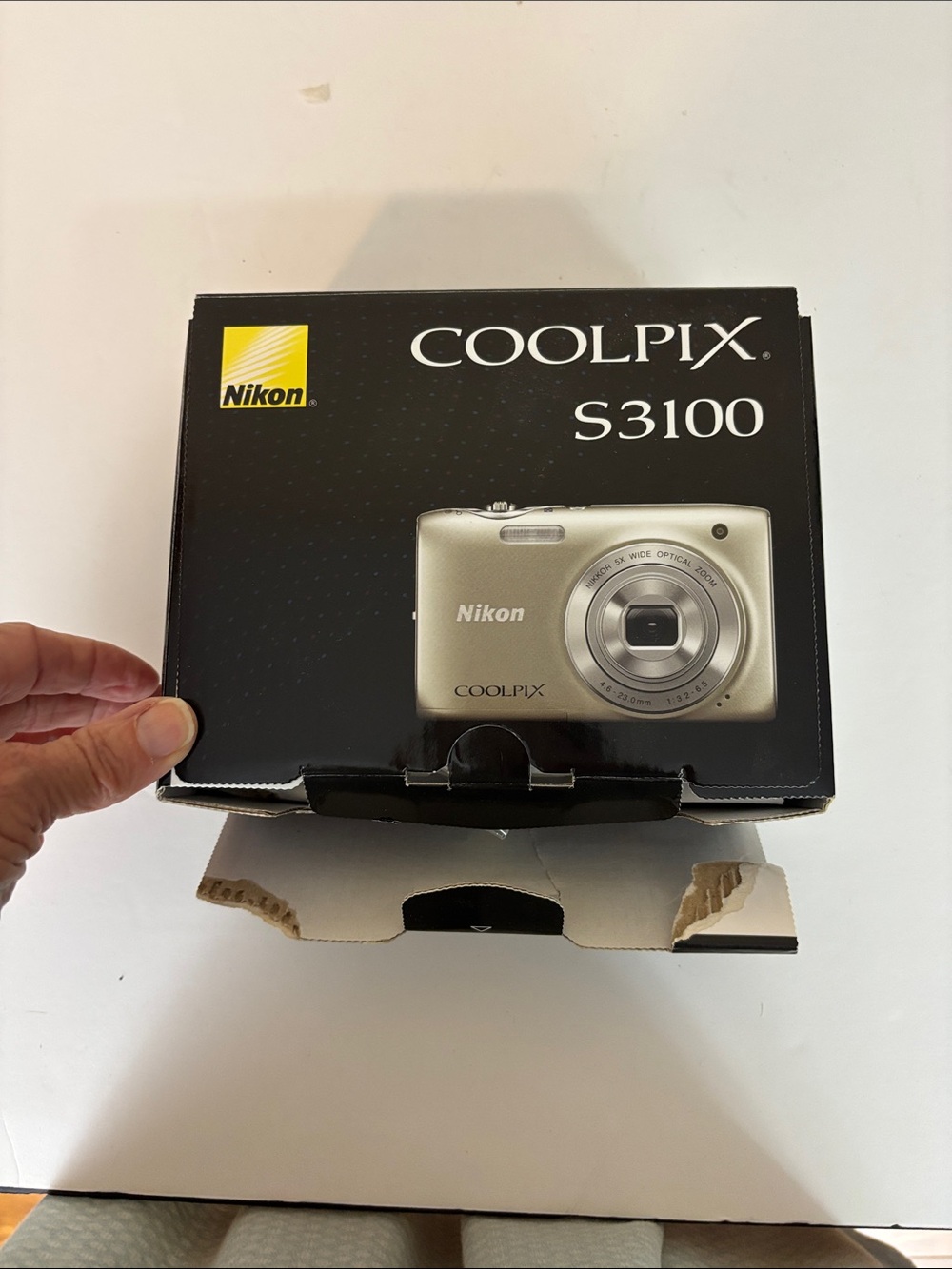 Nikon Coolpix S3100 camera with charger box and everything shown